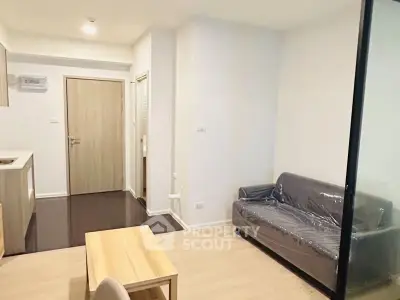 Modern living room with sleek furniture and open layout in a stylish apartment.