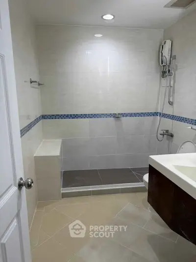 Modern bathroom with sleek design and shower area in a contemporary home.