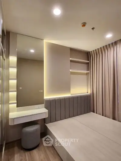 Modern bedroom with sleek design, built-in shelves, and ambient lighting for a cozy atmosphere.