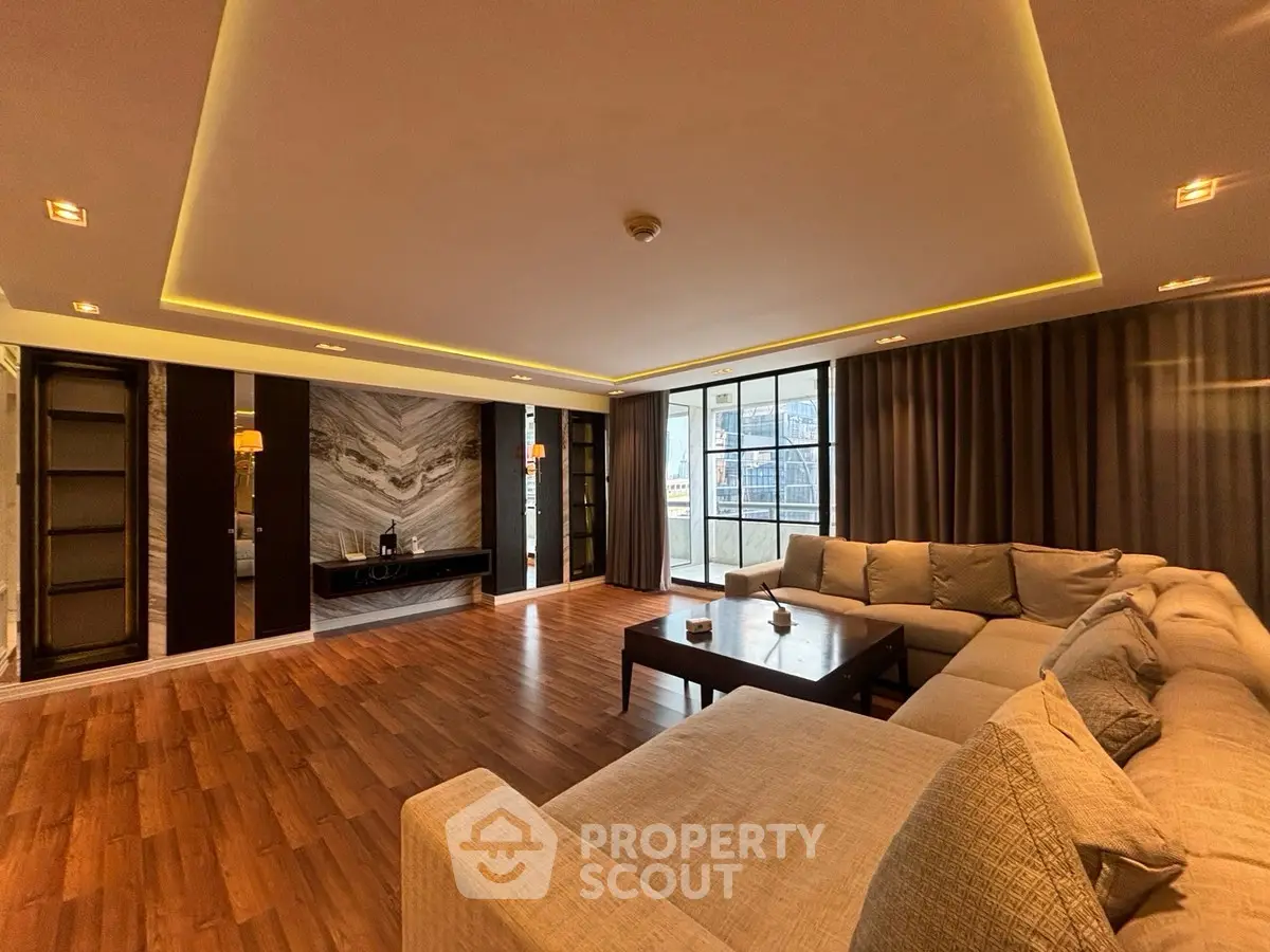 Luxurious living room with elegant lighting and spacious seating area.