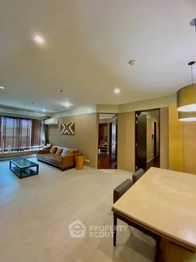 Spacious modern living room with elegant decor and ample natural light