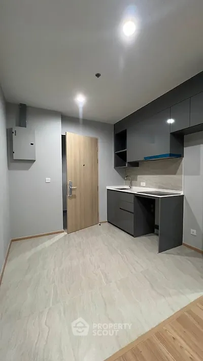 Modern compact kitchen with sleek cabinets and minimalist design