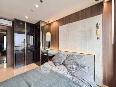 Luxurious modern bedroom with elegant decor and ample natural light.