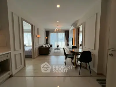 Modern open-plan living room with elegant decor and natural light