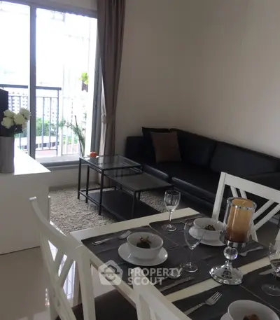 Modern living room with elegant dining area and balcony view