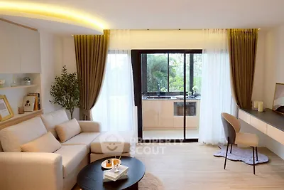 Modern living room with elegant decor and large window view