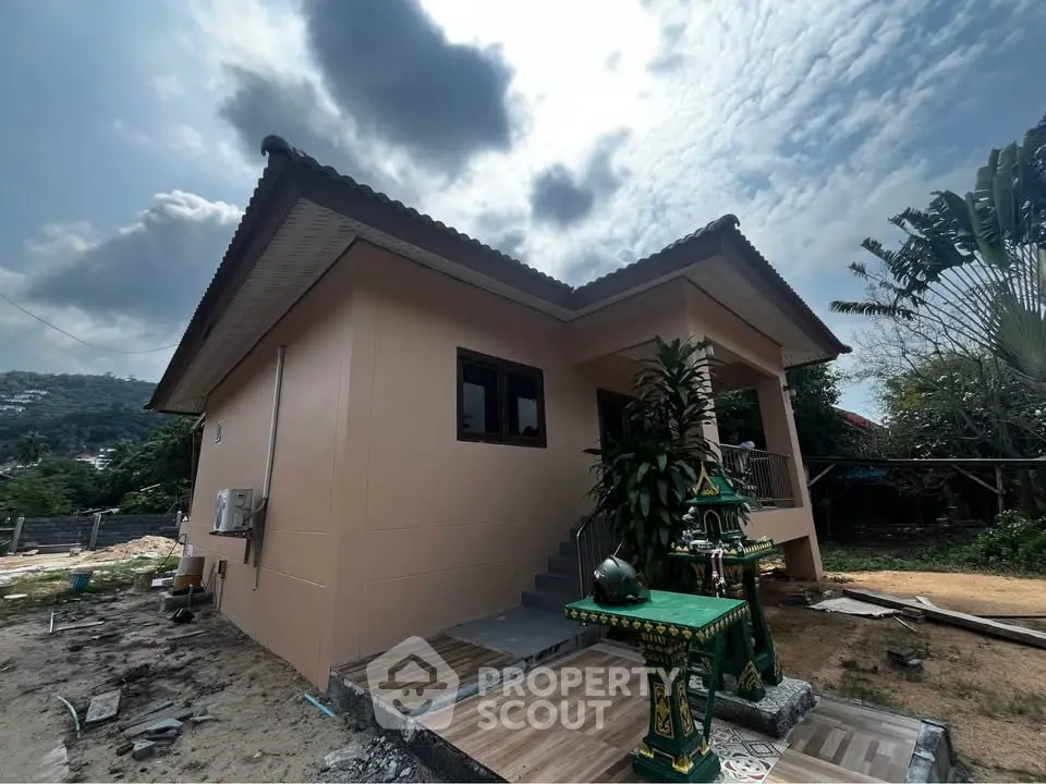 Charming single-story home with traditional architecture and lush surroundings