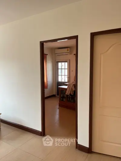 Spacious interior with natural light and modern design, featuring a cozy corner glimpse.