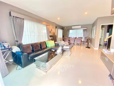 Spacious modern living room with elegant decor and ample natural light
