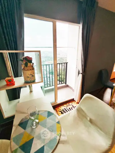 Chic modern living room with balcony offering stunning city views, perfect for urban lifestyle enthusiasts.