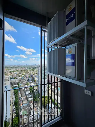 Stunning high-rise balcony view with cityscape and modern laundry appliances.