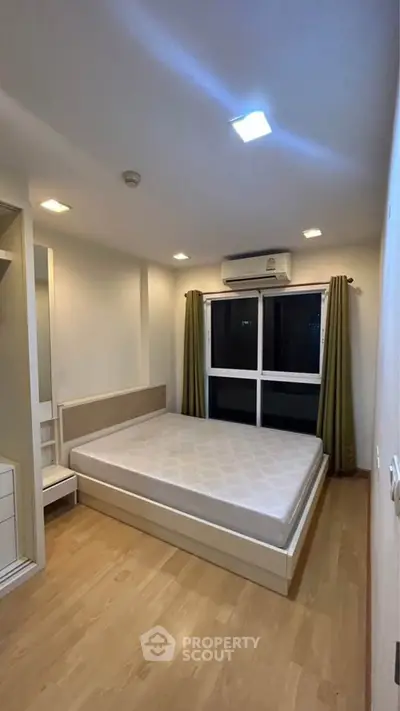 Cozy bedroom with modern design and ample natural light