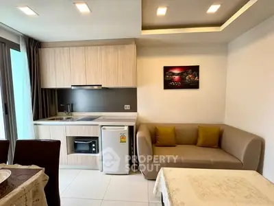 Modern compact kitchen with cozy living area and stylish decor