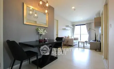 Modern living room with elegant dining area and stylish lighting in a cozy apartment.