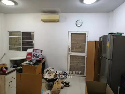 Cozy kitchen space with modern appliances and ample storage, perfect for culinary enthusiasts.