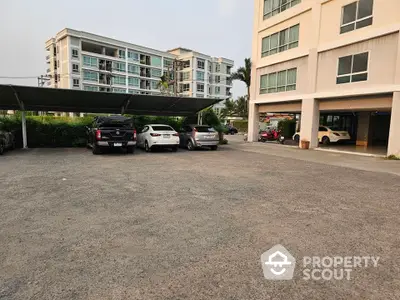 Spacious apartment building with ample parking space and modern design.