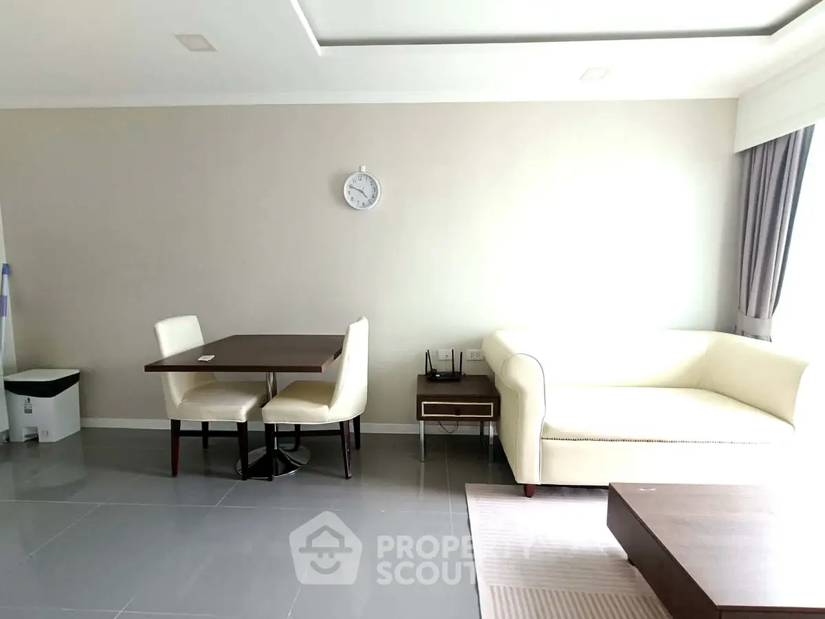 Modern living room with sleek furniture and natural light, perfect for relaxation and entertaining.