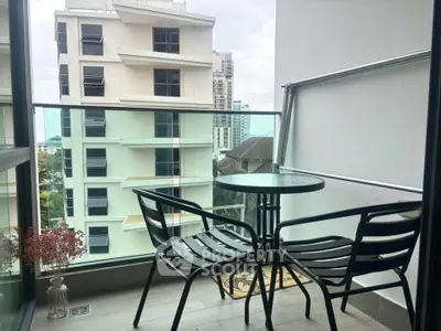 Chic urban balcony with stylish seating and cityscape view, perfect for relaxation and enjoying the skyline.
