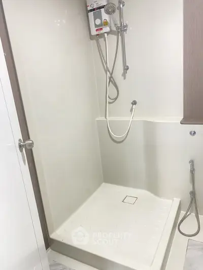 Modern bathroom shower area with sleek design and efficient layout
