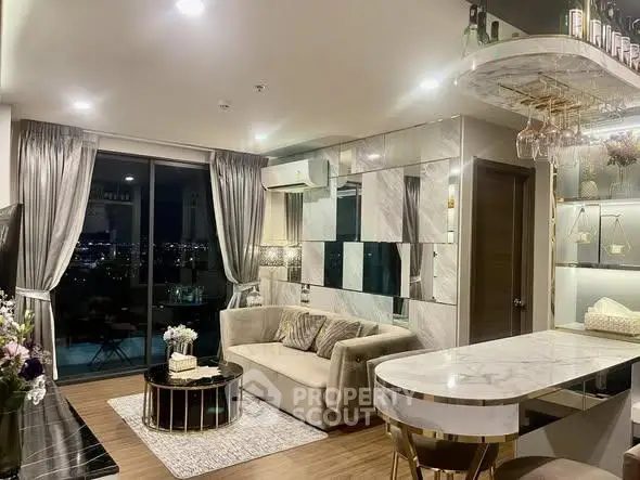 Luxurious modern living room with city view, elegant decor, and stylish furniture in high-rise apartment.