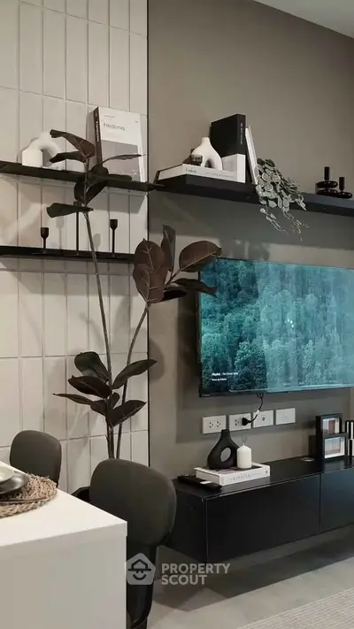 Modern living room with sleek decor and wall-mounted TV