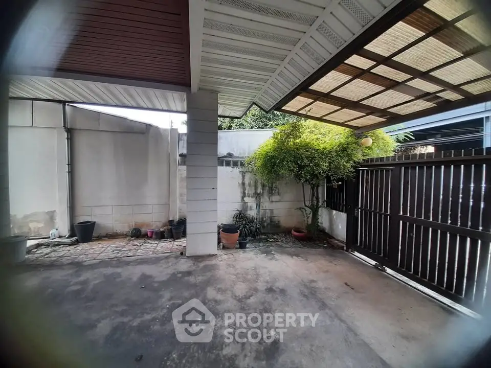 Spacious covered outdoor area with potential for customization and landscaping.