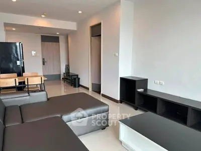 Modern living room with sleek furniture and open layout in a contemporary apartment.