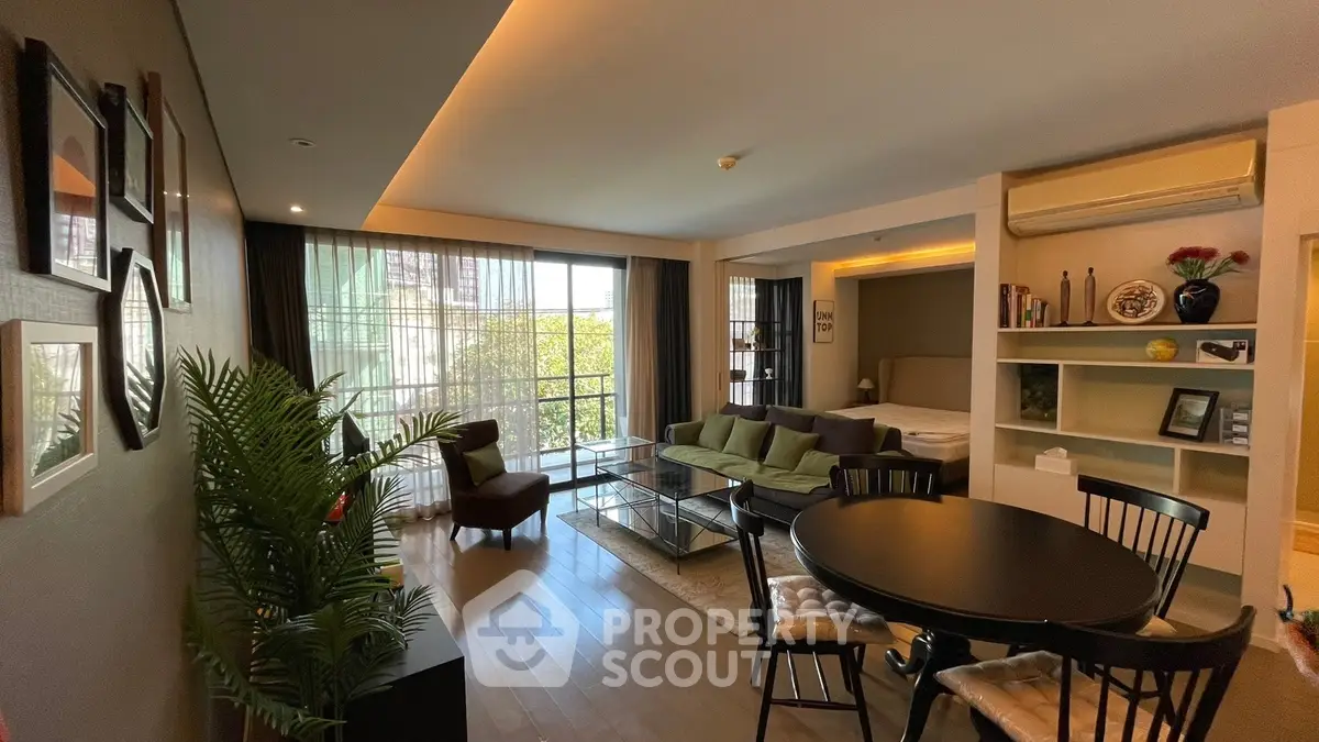 Stylish open-plan living room with modern decor and large windows