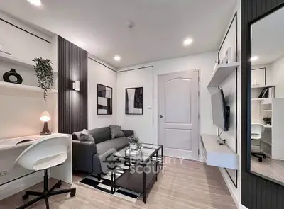 Modern living room with sleek decor, cozy sofa, and wall-mounted TV in a stylish apartment.