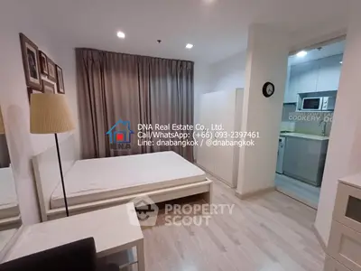 Modern bedroom with open kitchen in Bangkok condo for sale