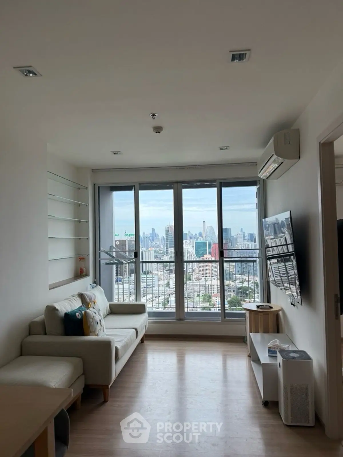 Modern living room with city view and stylish decor