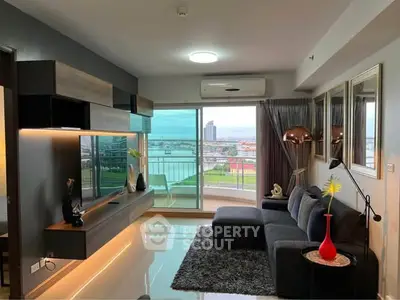 Modern living room with stylish decor and stunning city view from balcony.