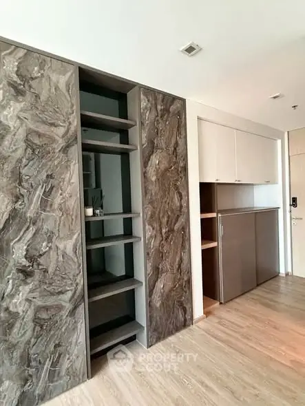 Modern interior with sleek storage solutions and elegant wood finishes.