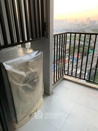 Modern balcony with city view and washing machine, perfect for urban living.