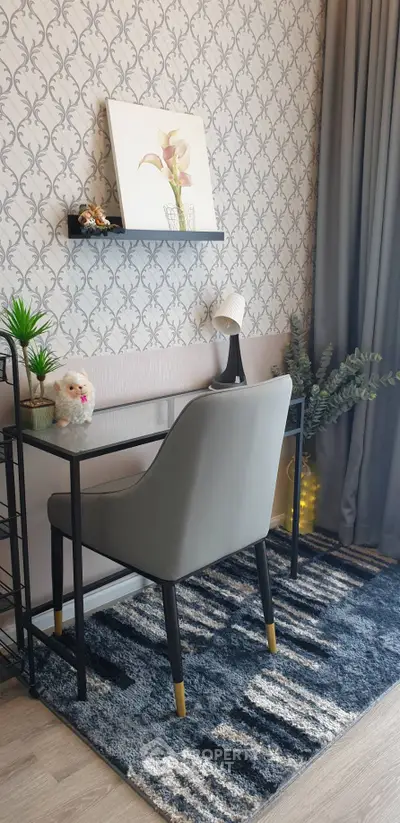 Chic study nook with modern decor and plush chair in stylish home.