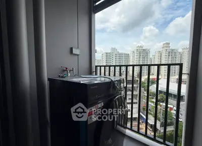 High-rise balcony with washing machine and cityscape view