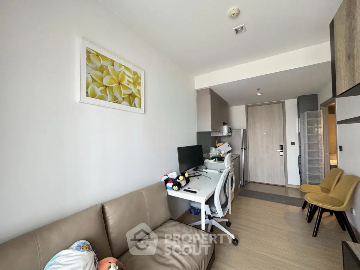 Modern living room with cozy seating and stylish decor in a contemporary apartment.