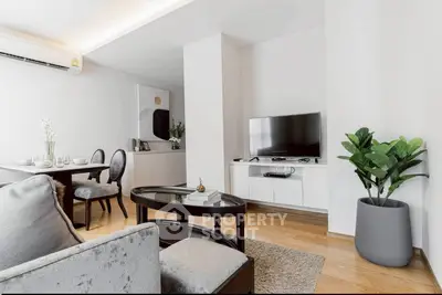 Modern living room with sleek furniture and elegant decor in a stylish apartment.