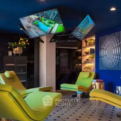 Luxurious modern living room with vibrant decor and unique ceiling-mounted TVs.