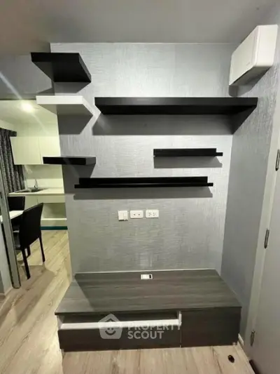 Modern interior with sleek wall shelves and stylish flooring in a contemporary living space.