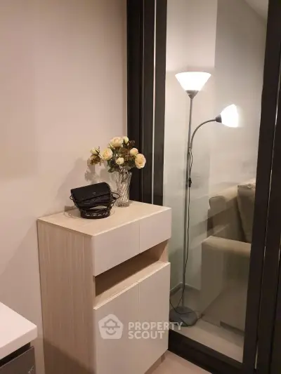 Cozy interior corner with modern furniture and elegant decor, perfect for a stylish living space.
