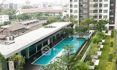 Luxurious condominium with rooftop pool and lush garden offering stunning city views.