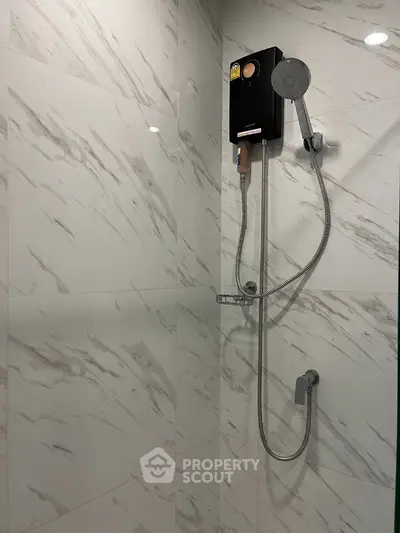 Modern bathroom with sleek shower design and marble tiles