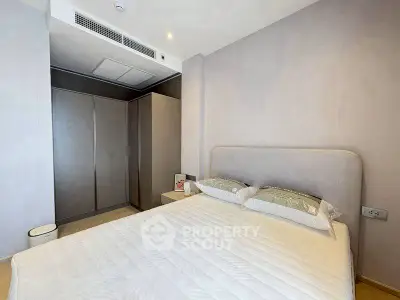 Modern bedroom with sleek design and ample storage space