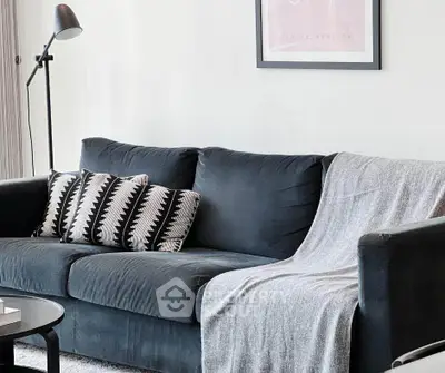 Stylish living room with cozy dark sofa and modern decor