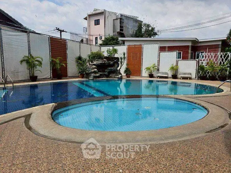 Luxurious outdoor pool area with serene ambiance and modern design, perfect for relaxation and leisure.