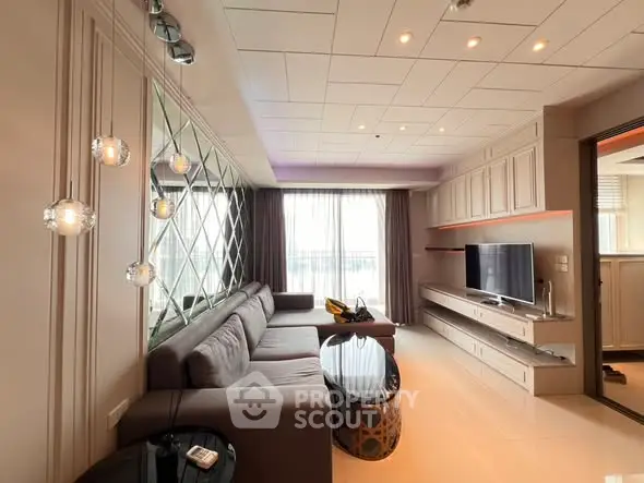 Luxurious living room with modern decor and large windows for natural light.