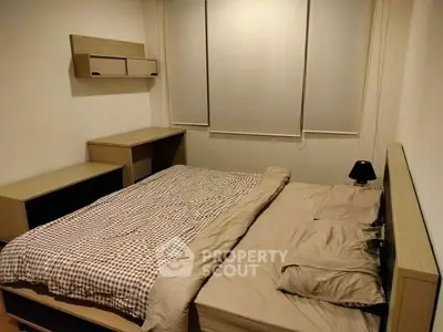 Cozy bedroom with modern furnishings and neutral tones, perfect for relaxation and comfort.