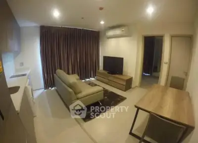 Modern living room with sleek furniture and open layout in a stylish apartment.