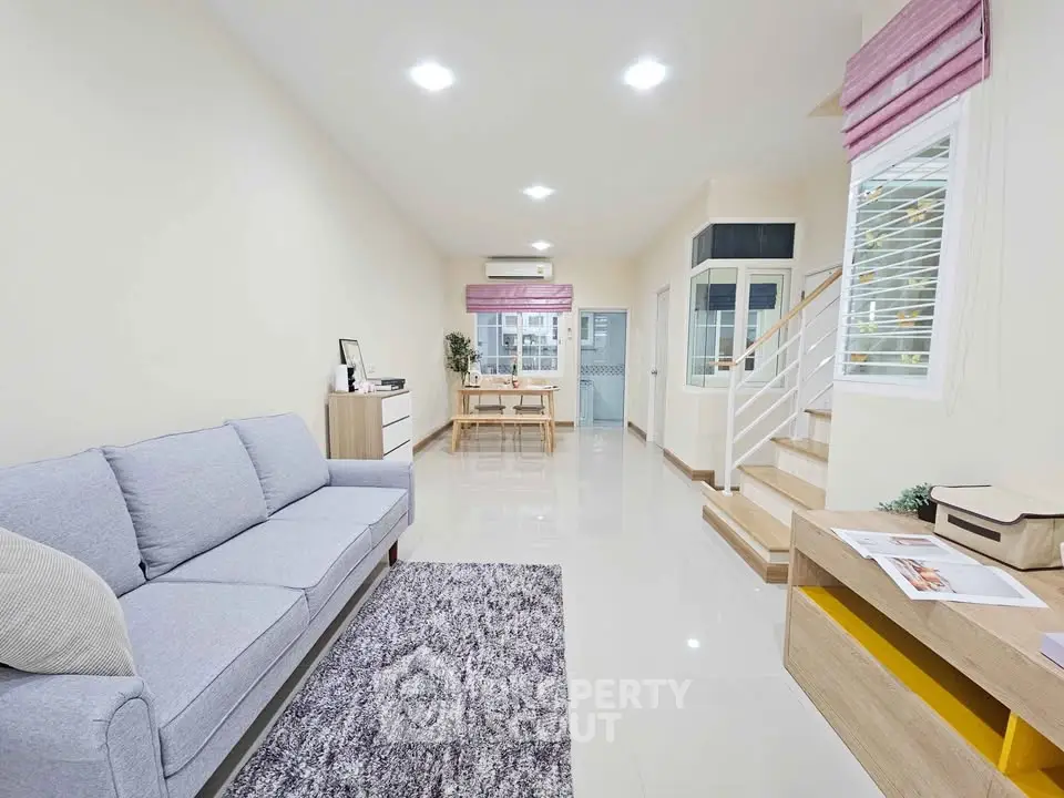 Spacious modern living room with sleek design and natural light